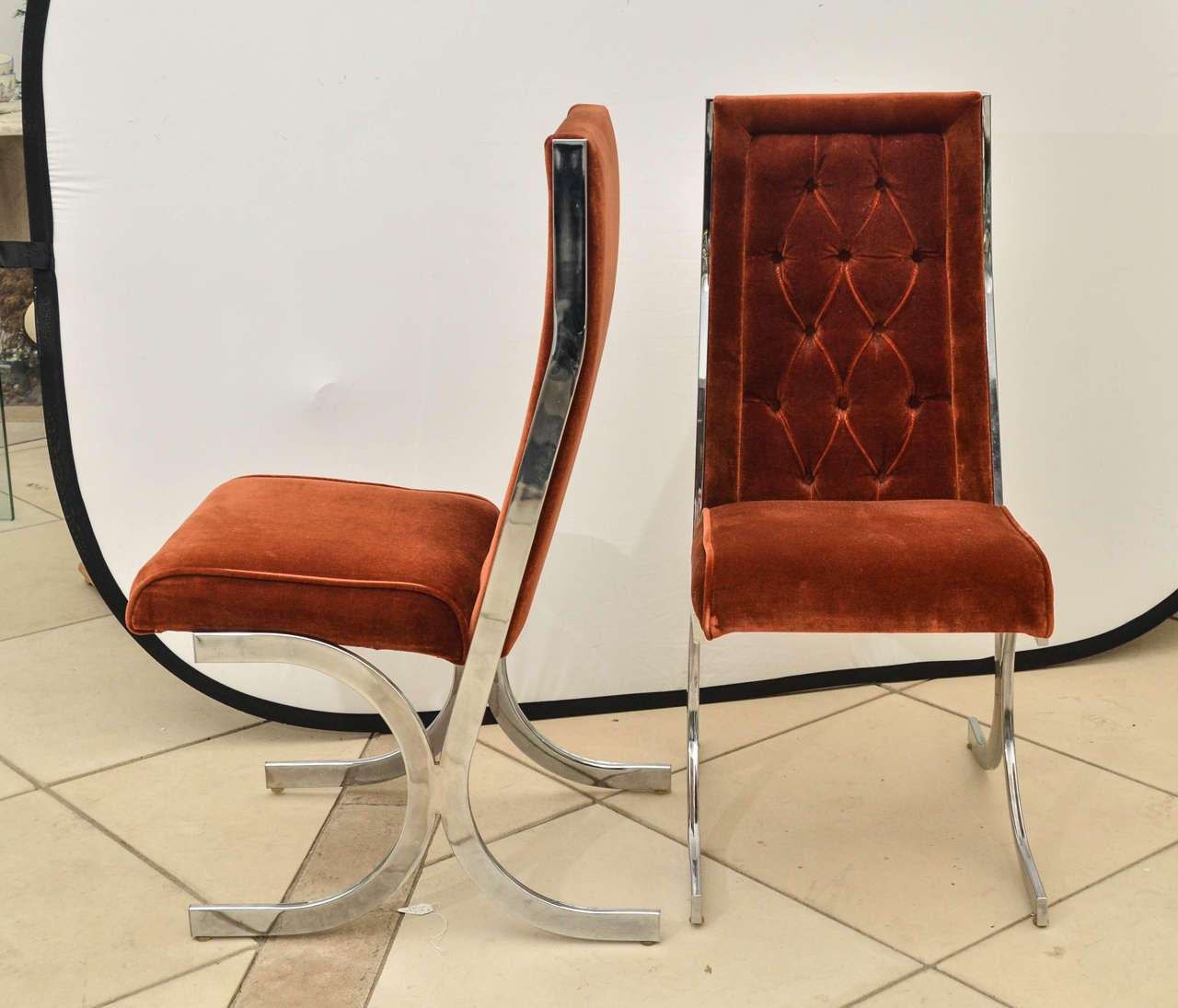 Set of four Mid-Century chrome dining chairs with original upholstery.