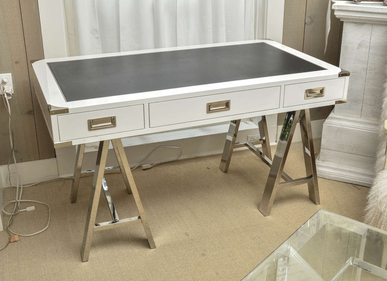 Attractive Mid-Century white lacquer Campaign desk with black leather top on chrome base by Lexington Furniture.