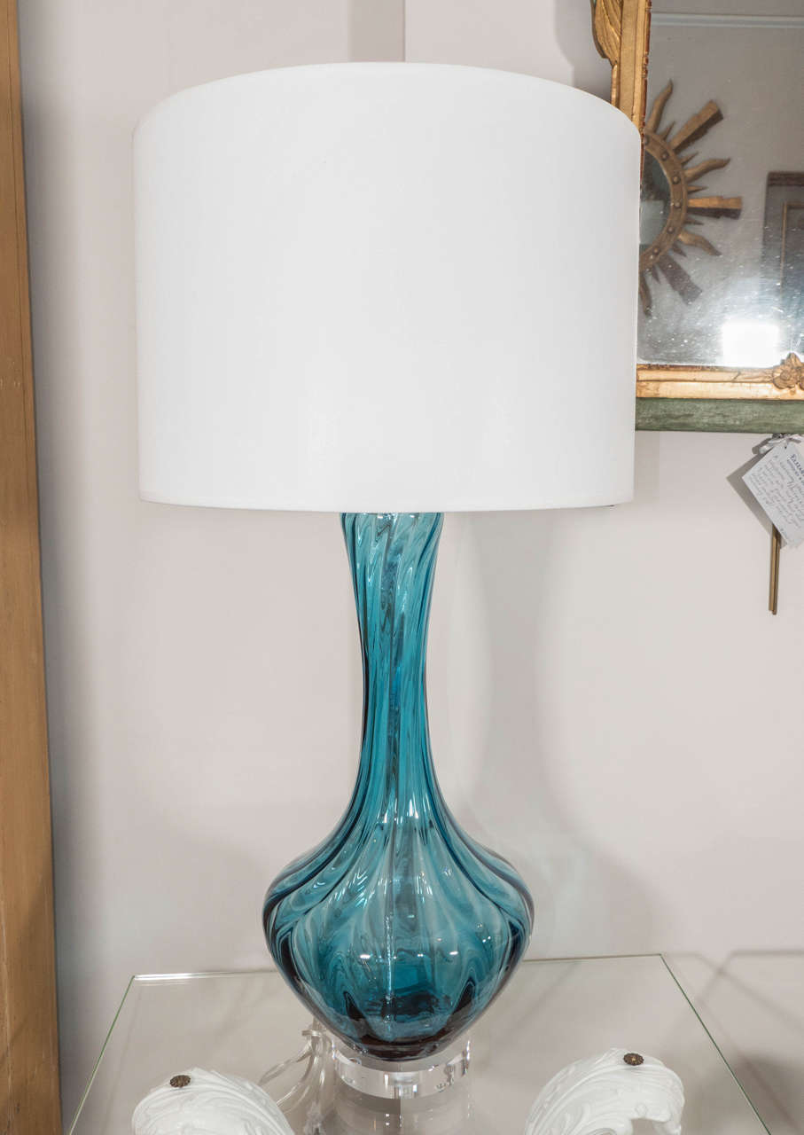 A sculptural Murano glass lamp in a stunning blue on a Lucite base.