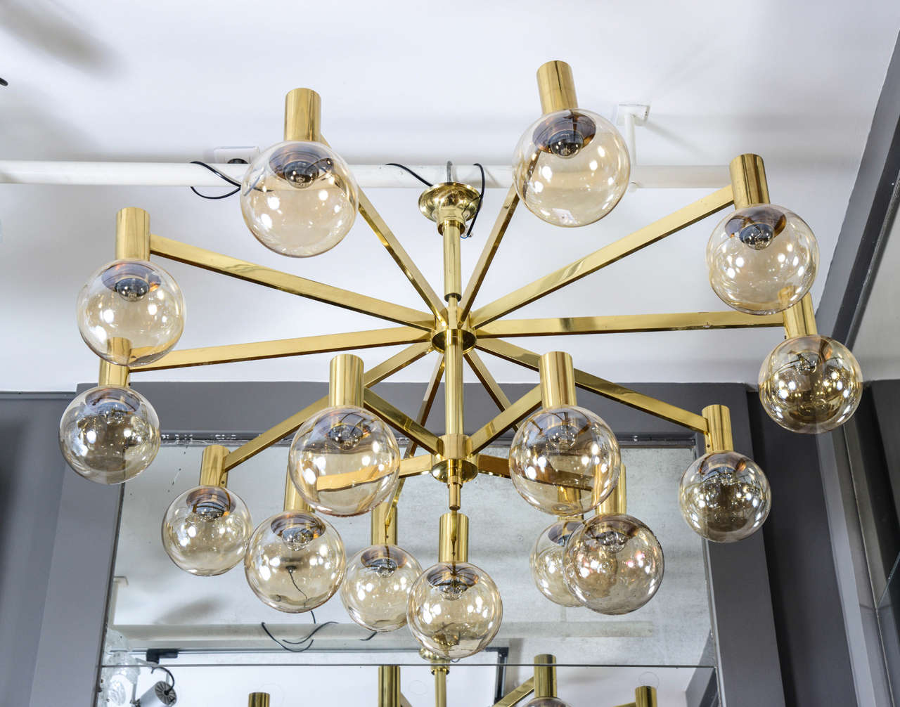 Rare chandelier designed by Hans-Agne Jakobsson made of a brass structure with two levels of arms. Each of the fifteen-arm of light is supporting a tinted blown glass globe.