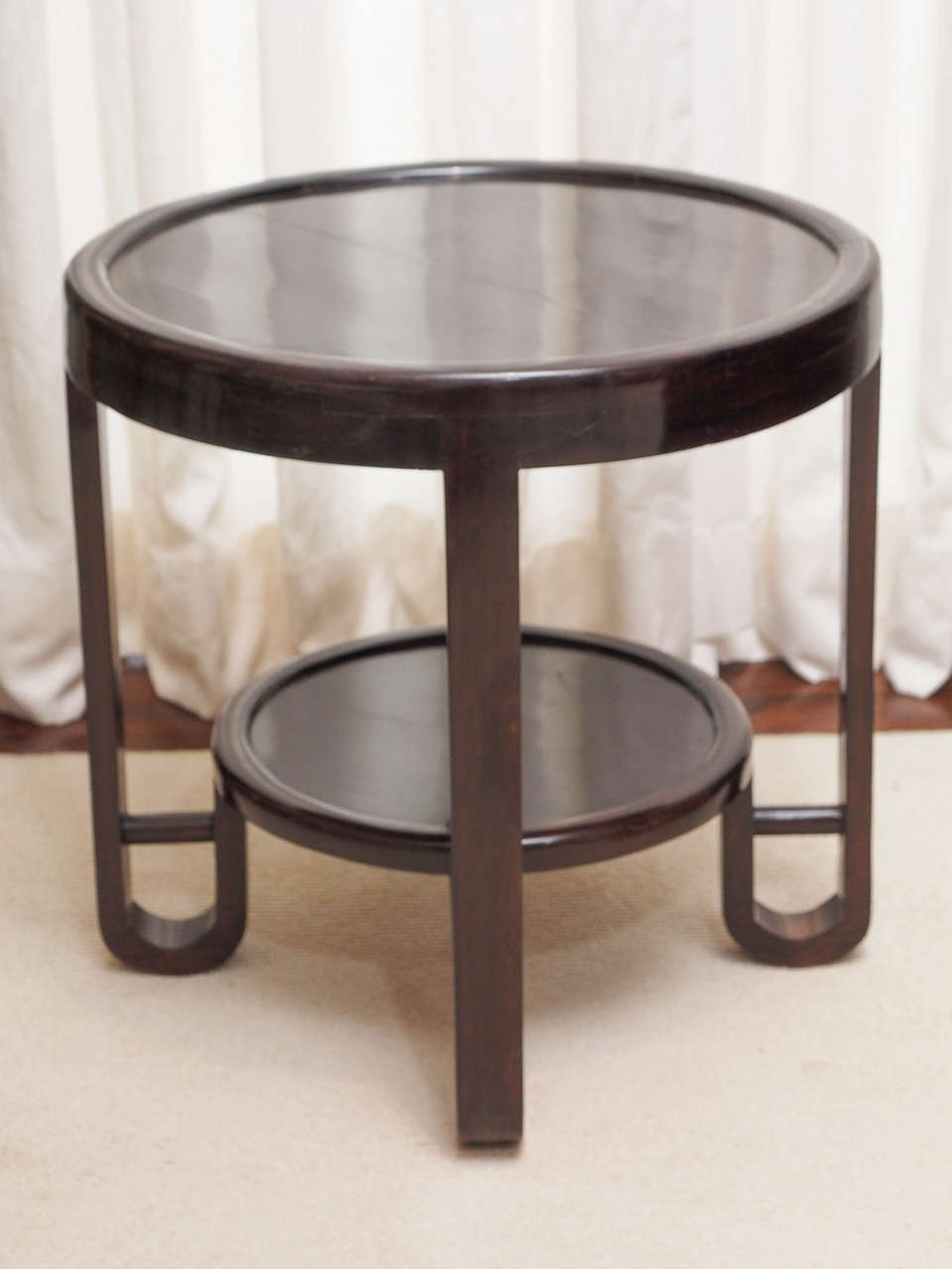 Small two-tier side table; interesting curved shape to the legs