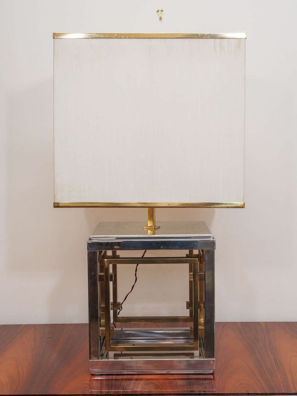 Call for sale price. Square two-light table lamp in brass and chrome; measurements include the original brass-trimmed shade.