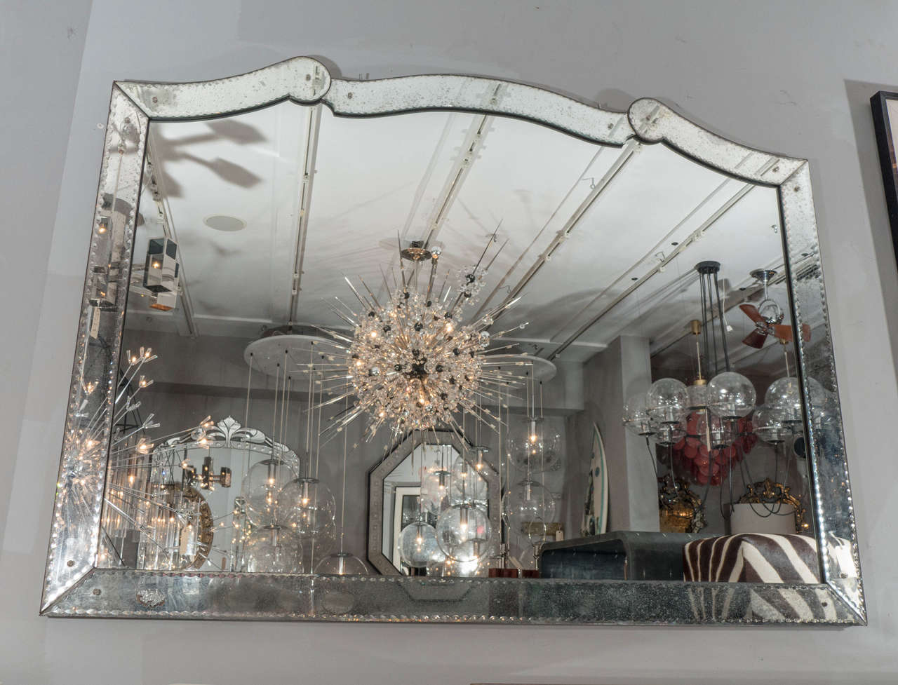 Beautiful Venetian style mirror with pie crust edging detail.
