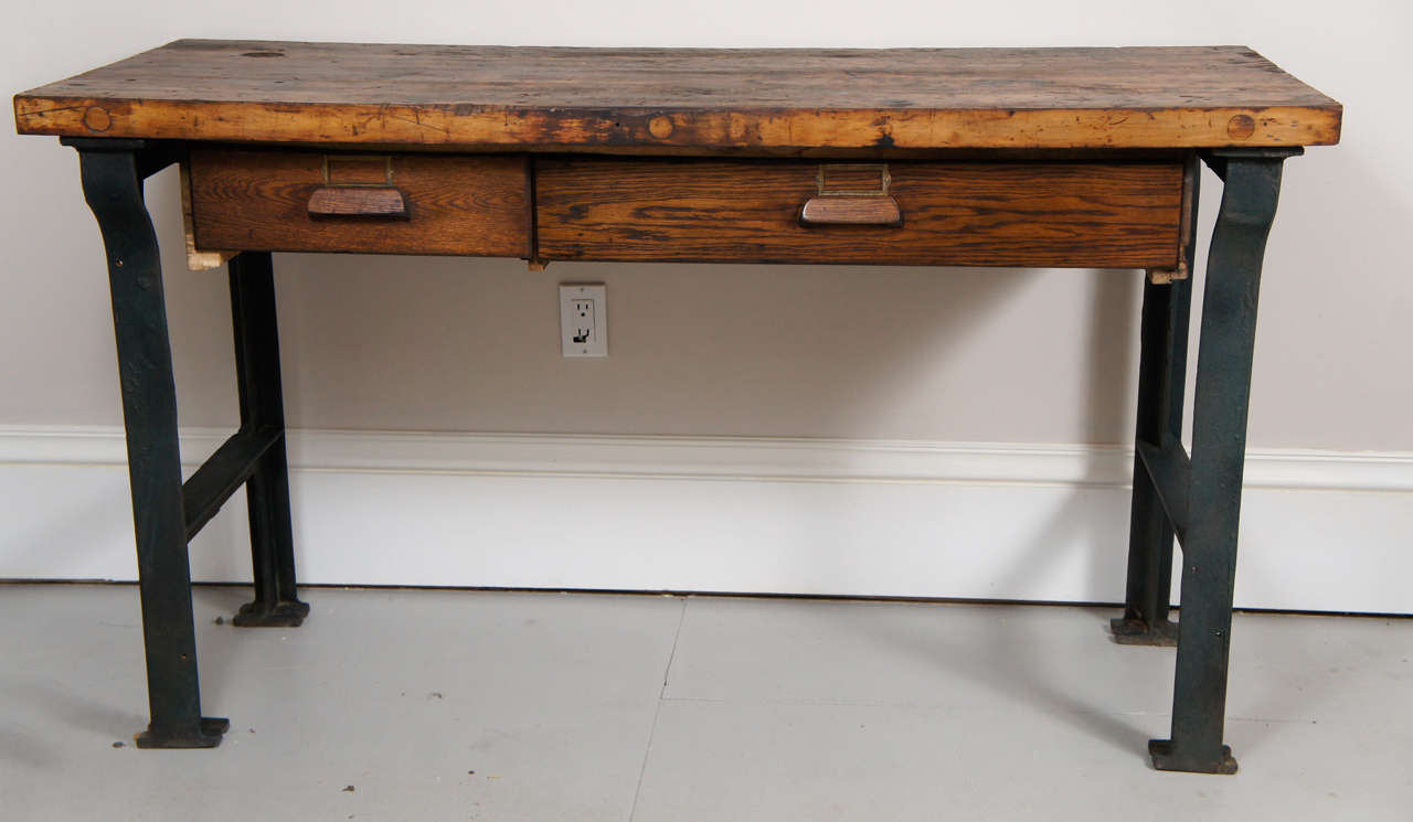 A heavy and solid industrial work table with two drawers. The table is 34