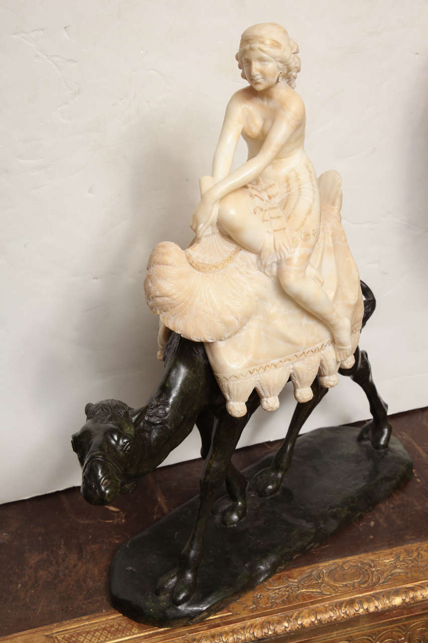 A very fine quality French Art Deco  Bronze and alabaster  group of a young beauty riding a camel and holding a feather fan.  
French circa 1900 . Unsigned
Stock Number: SC4