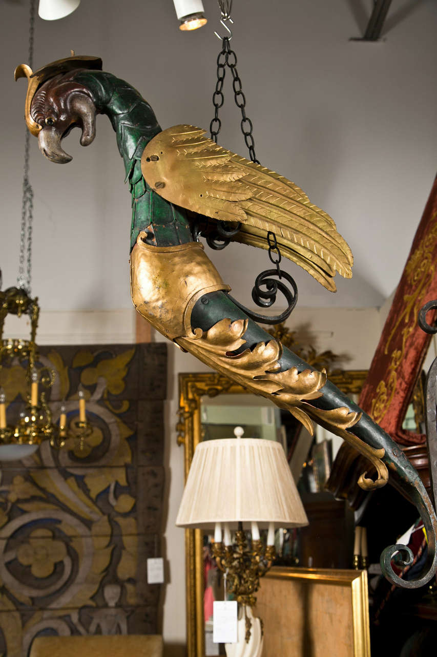 An iron and tole cold painted Italian Griffin. Possibly a lantern holder at one time. 