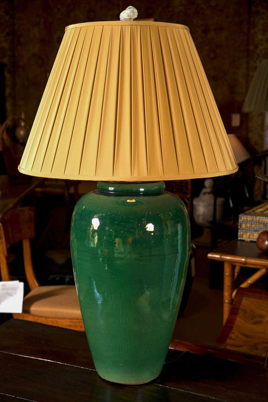 A Pacific Pottery oil jar with high gloss green glaze now electrified.
Height to top of lamp finial = 41 inches.