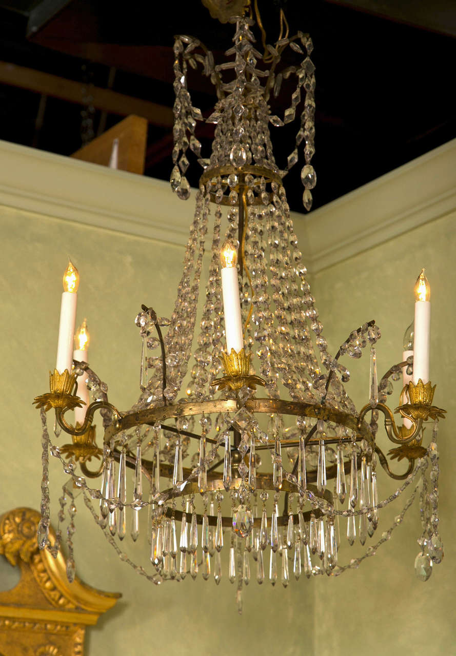 A Northern European Neoclassical cut glass mounted ormolu six light chandelier.