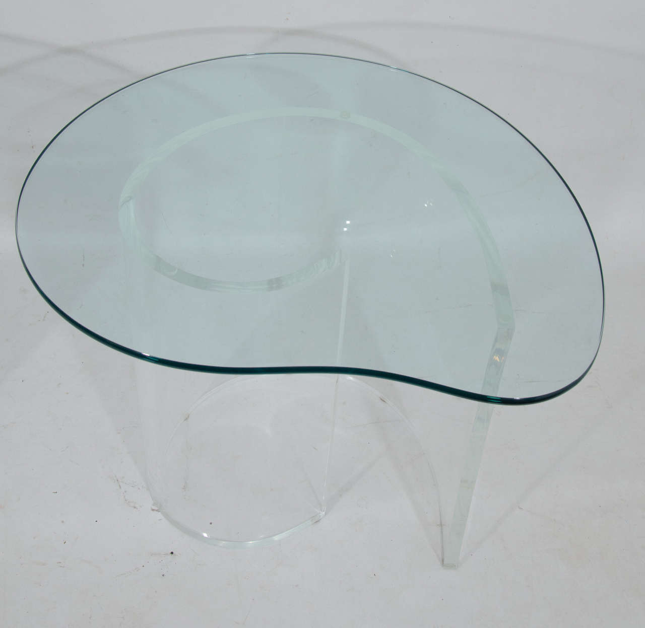 Beautiful end tables with lucite sculptural base and free form glass tops by Neal Small. It is rare to have a pair. Please contact for location.