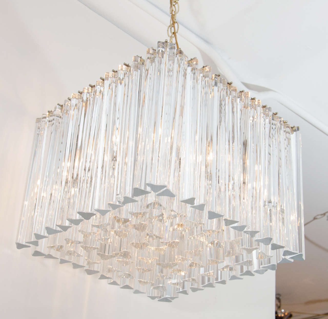 Beautiful and architectural chandelier by Camer. An unusual square armature holds several tiers of crystals of varying length which are arranged to be flush along the bottom. Versatile scale. Impressive. Please contact for location.
