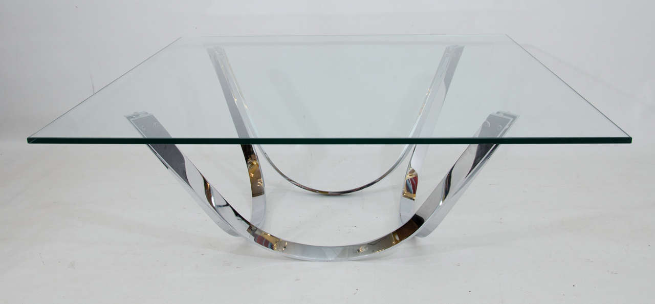 Beautiful architectural, sculptural chrome base supports a generous glass top. Please contact for location.