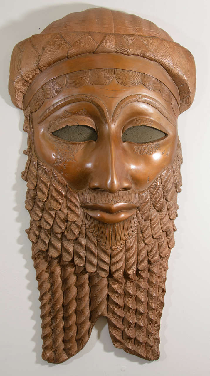 A late 20th century wall hung sculpture depicting the head of King Sargon, Iraqi ruler during the Akkadian Empire. Cast bronze. Good vintage condition with minor loss of patina on the tip of the nose.