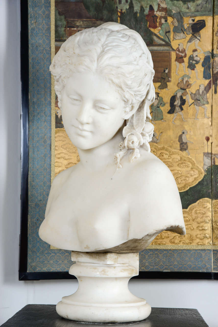 White marble bust of a young woman, the head leaning on one side, dreamy gaze, wearing a very pretty flowers and daisies headdress.

France, 1880s.

Measures: Height 60 cm, width 47 cm, depth 25 cm.

 