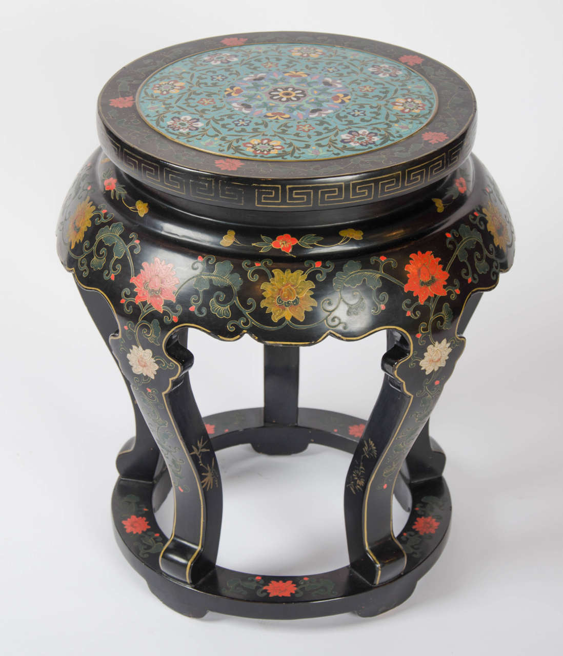 A superb circular Chinese side table of black lacquer and painted decoration with a fabulous blue enamel cloisonné inset top.
