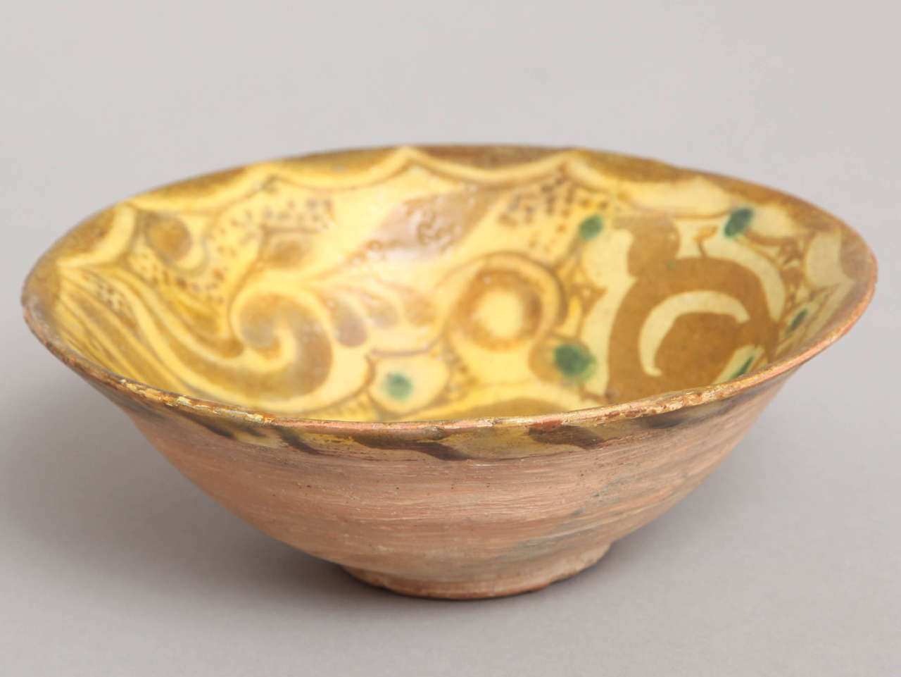 Nishapur, Persia circa 1300-1400 
Decorated earthenware bowl with dove and circular motifs.