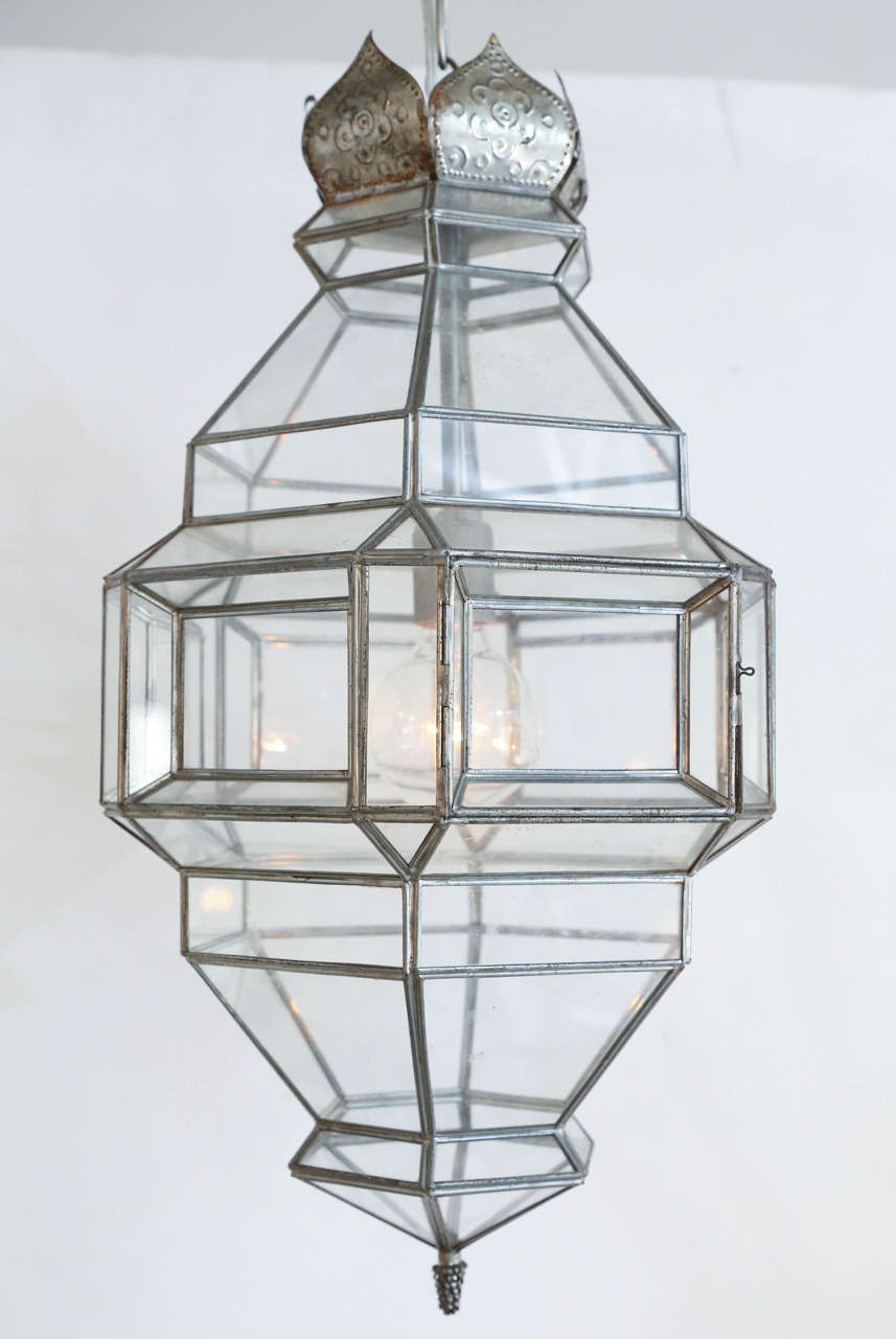 Diamond-shaped clear glass lantern from Granada, with silver finished panes holding multifaceted panels of glass, topped by a reticulated crown, newly wired to accommodate one Edison bulb.