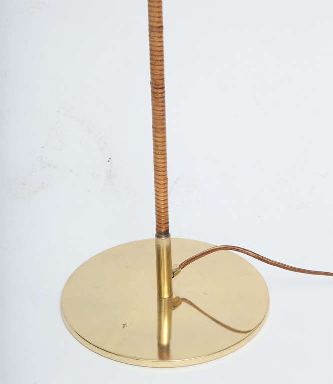 Pair of Paavo Tynel Floor lamps

manufactured by Taito Oy

brass and cane

marked TAITO

shade diameter 21