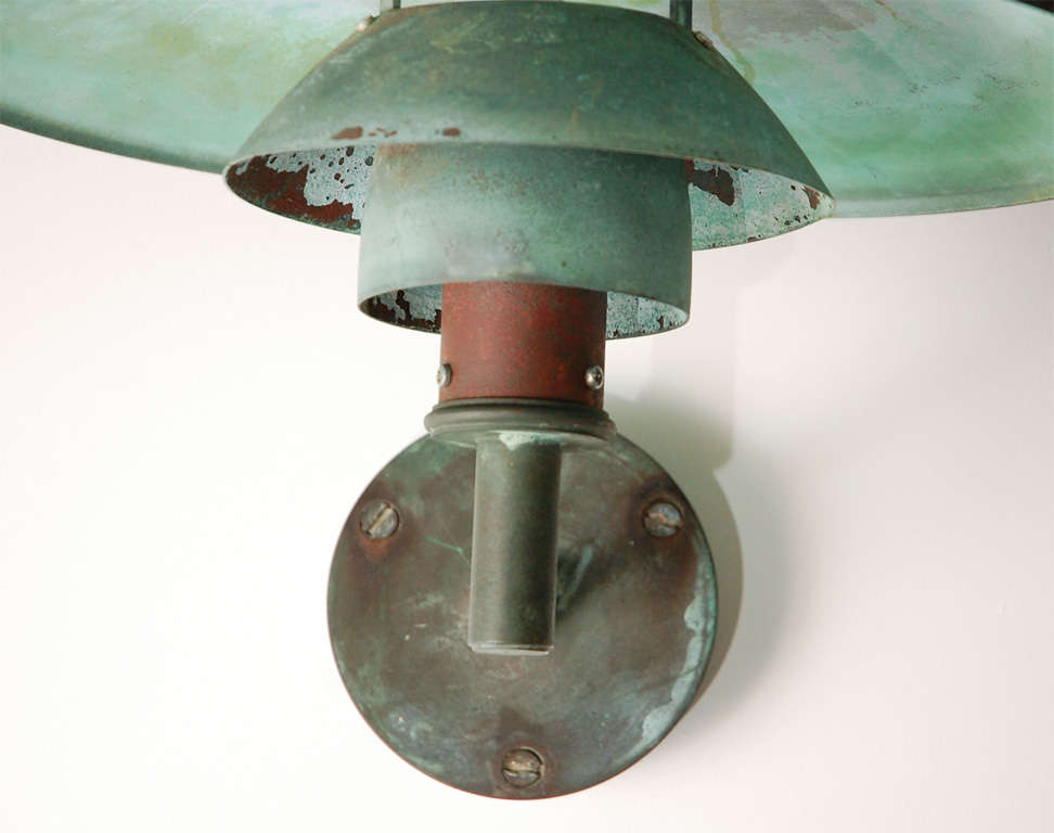 Copper patinated wall light w/large shade.