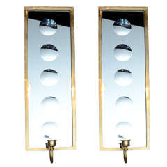 Wall mirrored wall sconces in the style of Fornasetti