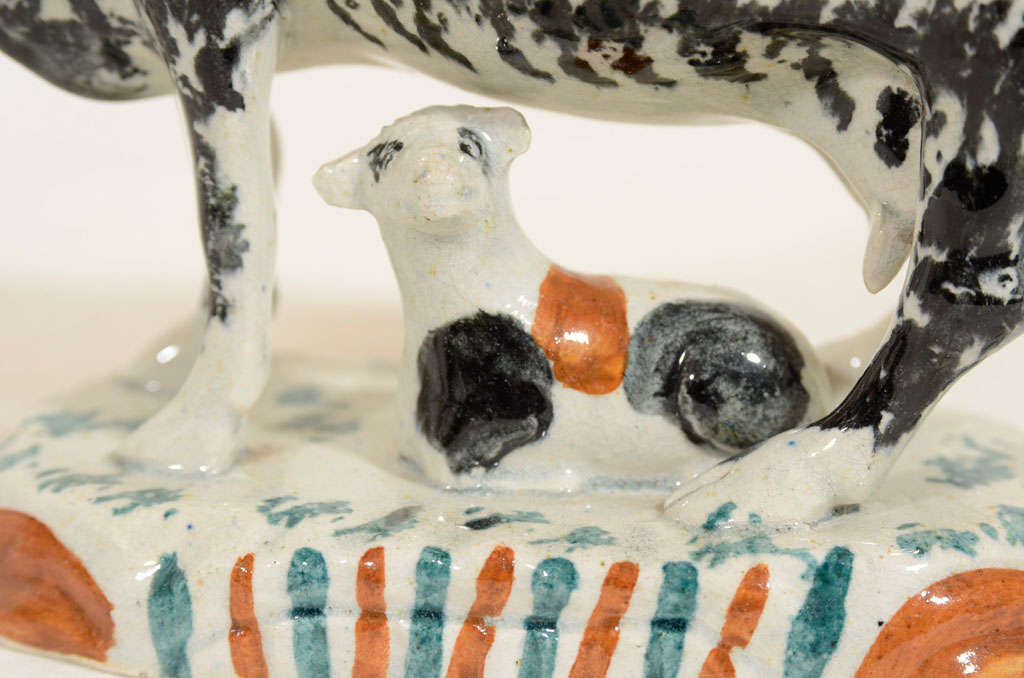 18th Century and Earlier A Pair of Sponged Prattware Pottery Cows with Calves