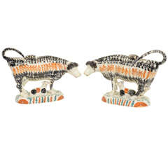 A Pair of Sponged Prattware Pottery Cows with Calves