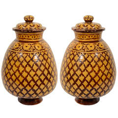 A Pair of Slip Decorated Covered Vases