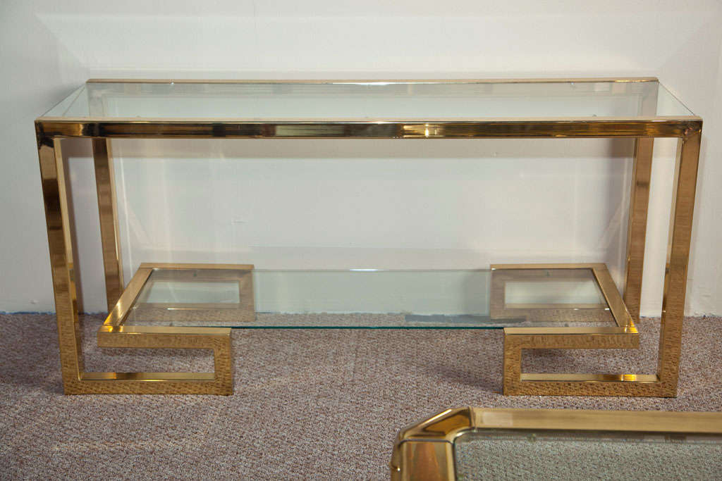 Statement -making Milo Baughman attributed console.   New Glass with polished frame.