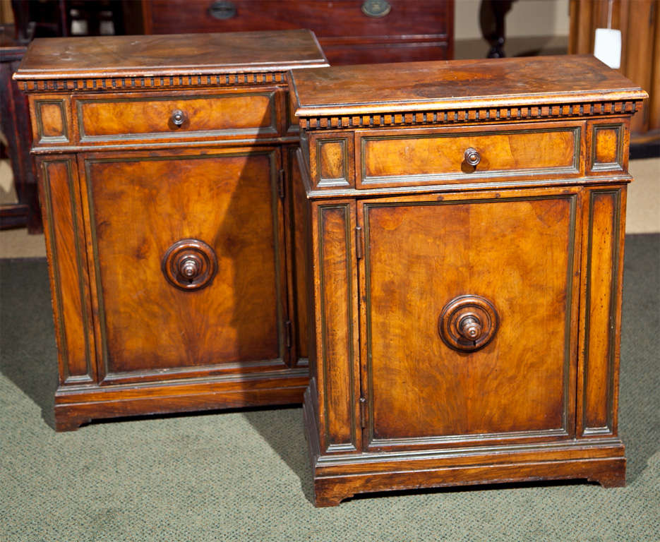 A pair of one-drawer, English burlwood cabinets.