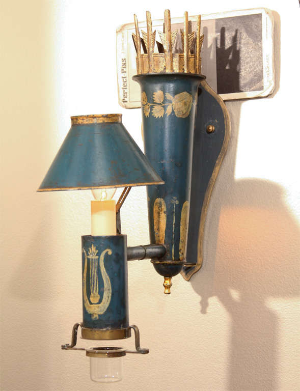 Fine pair of 19th century french tole wall sconces with shades and original oil cup at the base in original paintwork