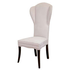 An American High Wing Backed Upholstered Chair.