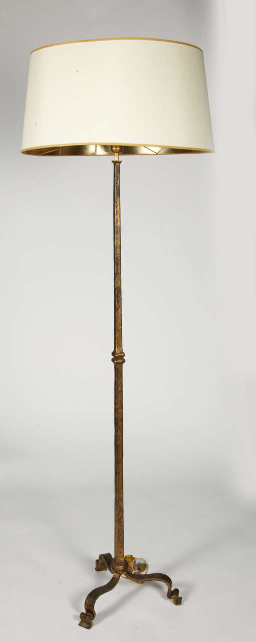 Nice floor lamp in gilt wrought iron by Maison Ramsay.
(no shade provided).