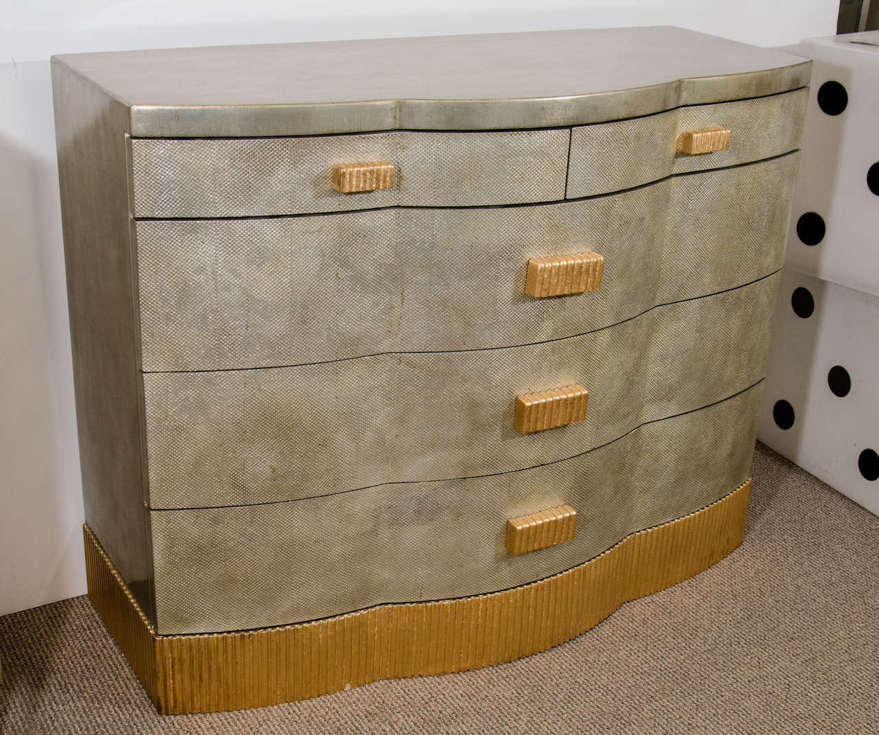 A vintage five-drawer chest or dresser with silver finish and gold leaf ribbed base and pulls.

Reduced from: $5,500.