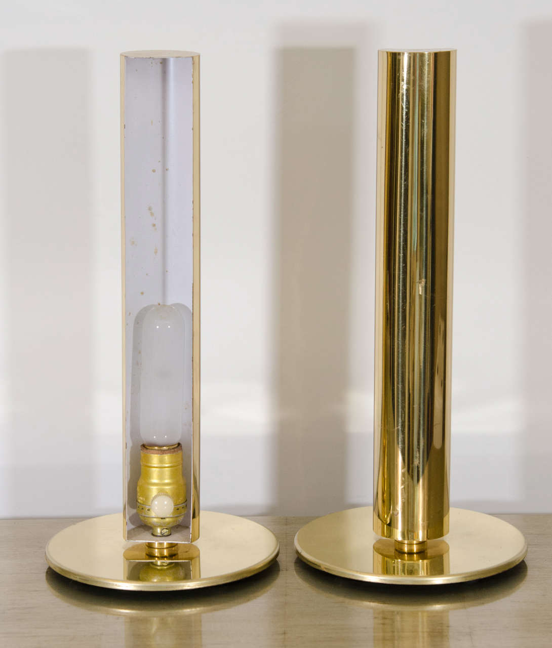 A vintage pair of brass cylinder lamps by Kovacs with label.

Reduced from: $3,200.