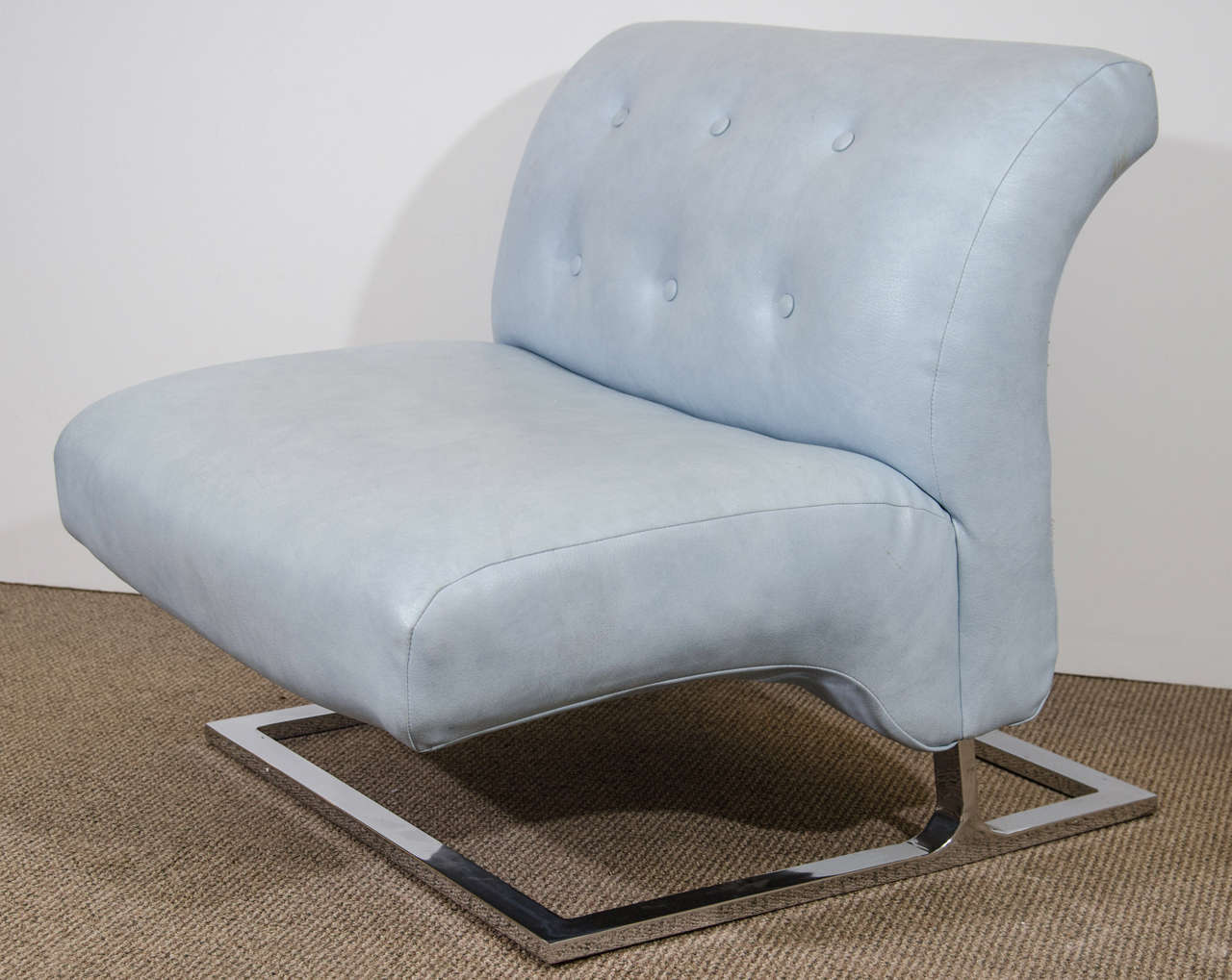 A vintage powder blue lounge slipper chair by Thayer Coggin, upholstered in naugahyde on a curved chrome base. Good overall condition, any wear consistent with age and use.