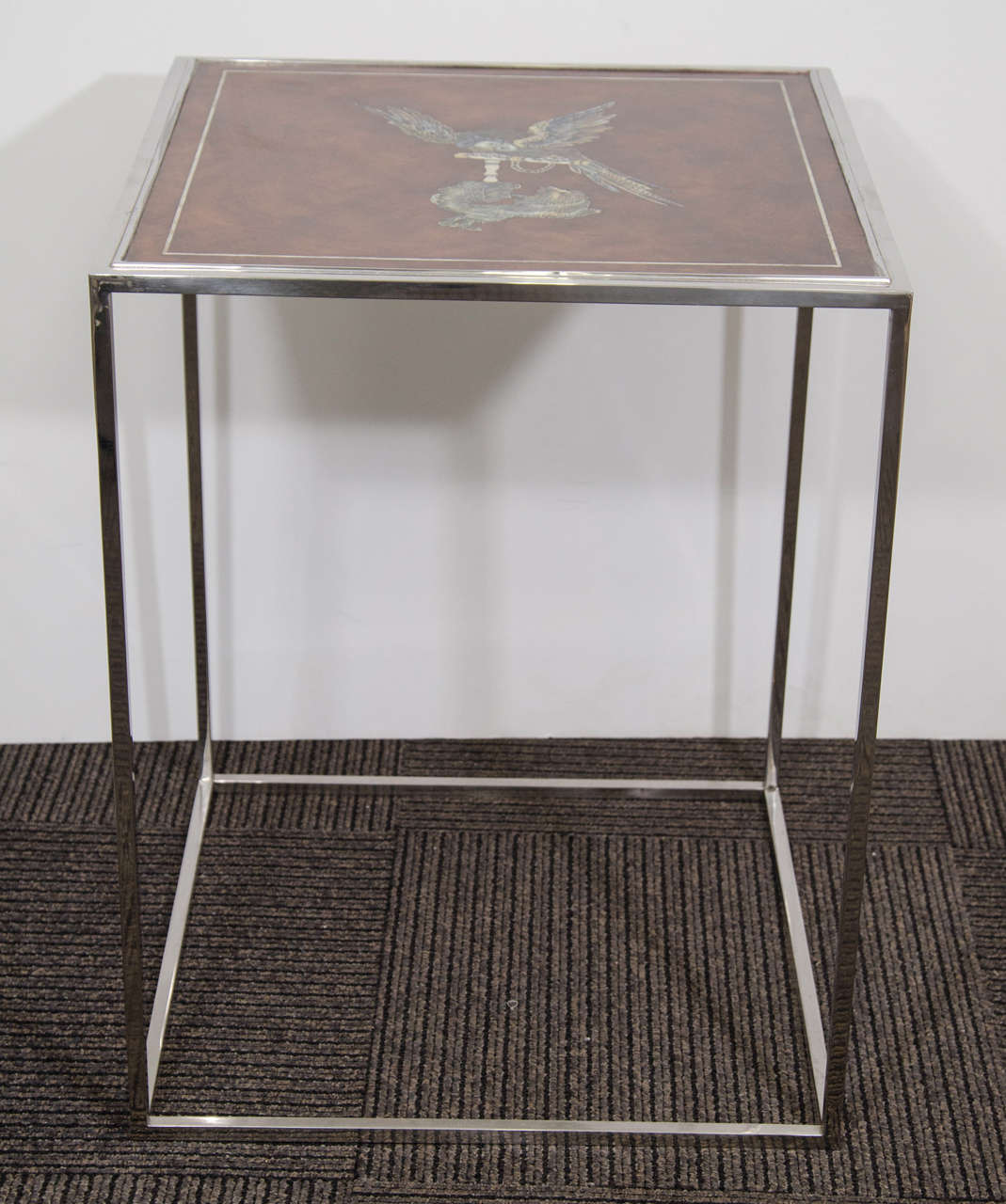 A vintage burl wood and stainless steel side table with mother of pearl inlay, depicting an parrot and dog. Very good condition, consistent with age and use.