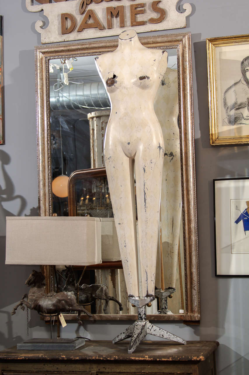 Great piece of sculpture- female form on its original stylized deco style tripod stand. Worn and distressed, with light remnants/shadows of a harlequin pattern on the torso.