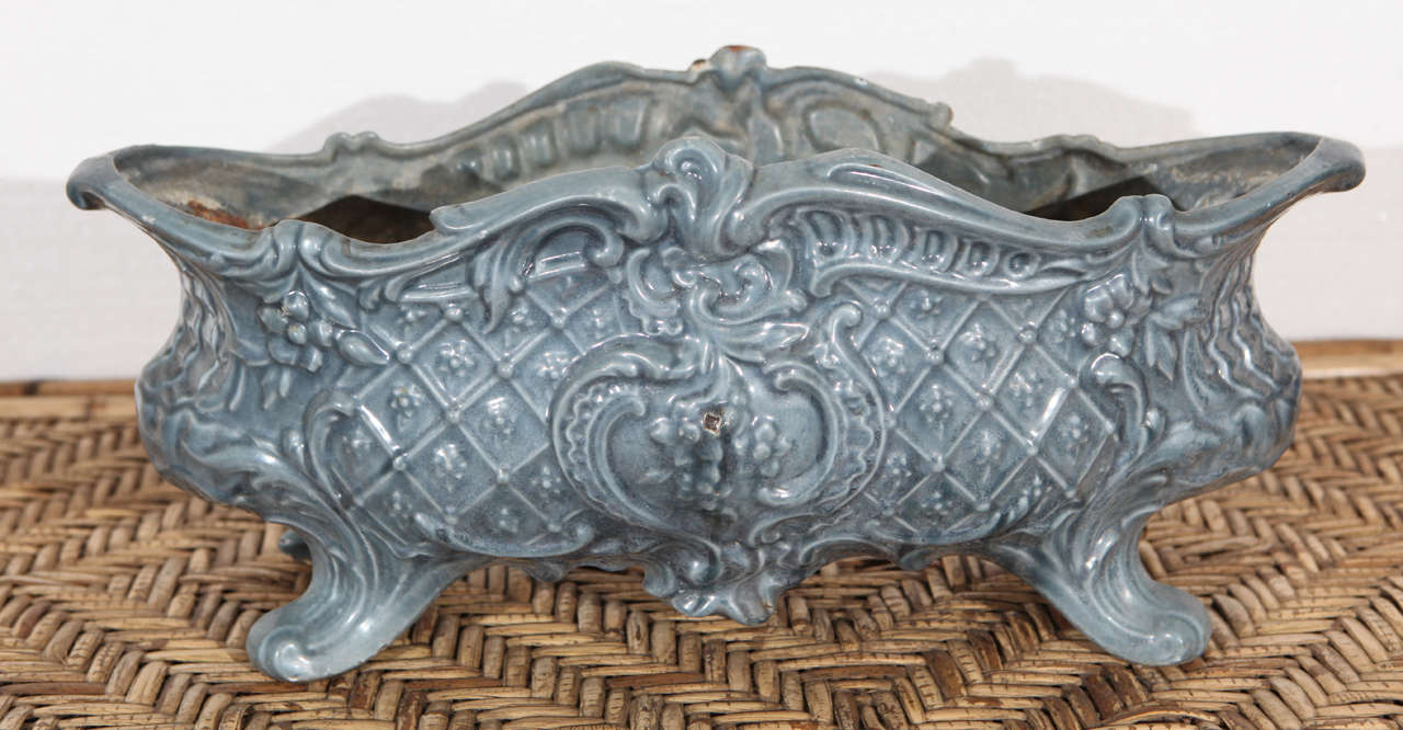 19th Century French footed, blue, jardiniere in cast iron with an enamel finish.
Some small losses to corners, with mild rust showing, but appropriate for the age of the piece. Interior surface is not finished and shows rusty surface. No cracks or