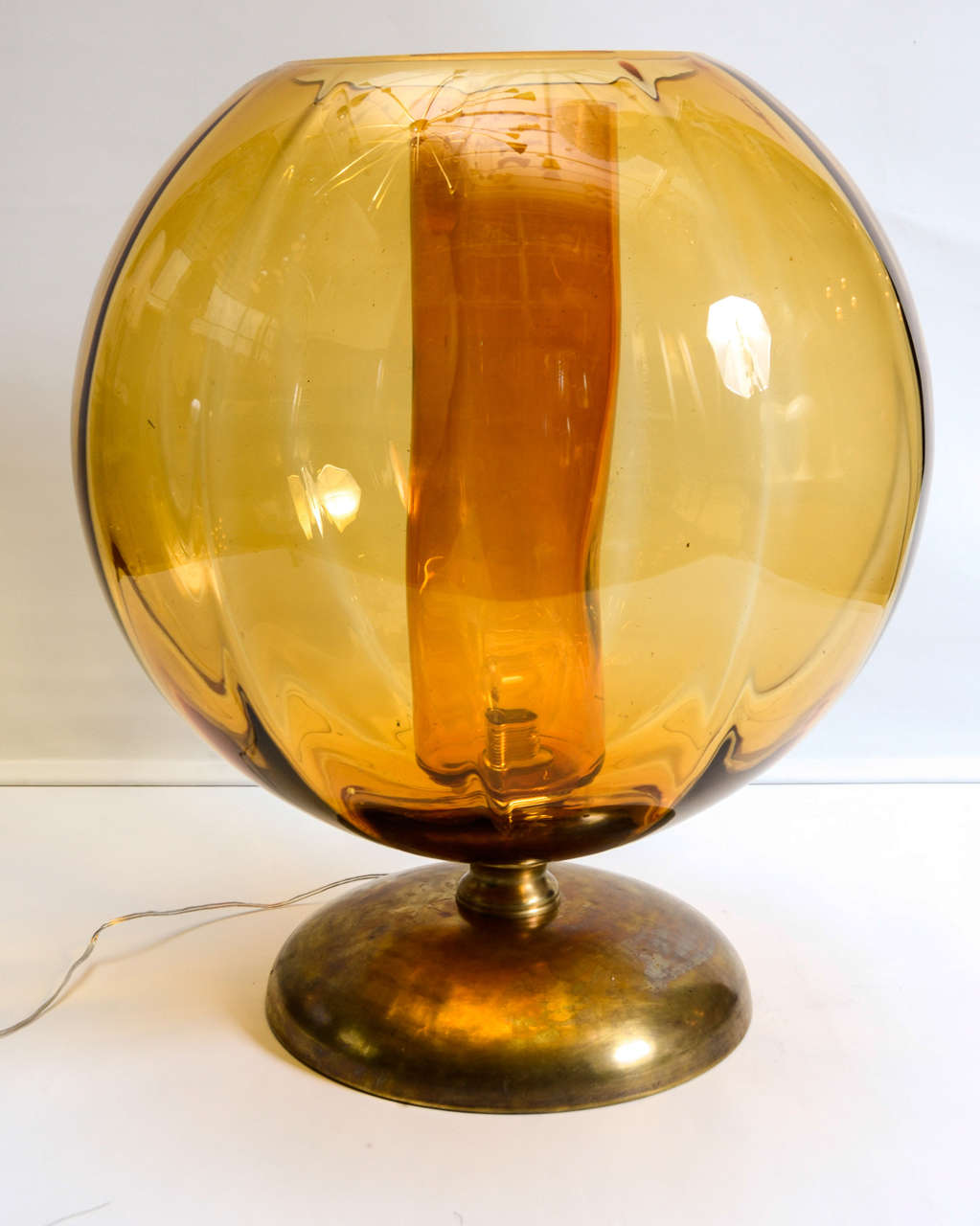 Pair of Big lamps made of brass feet, a big Murano glass globe and a cylinder in the same glass and color. New electrification, perfect condition.