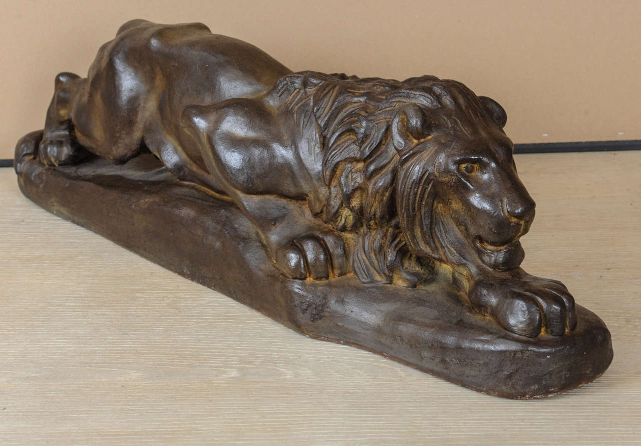 A bronze coloured Italian terracotta lion.