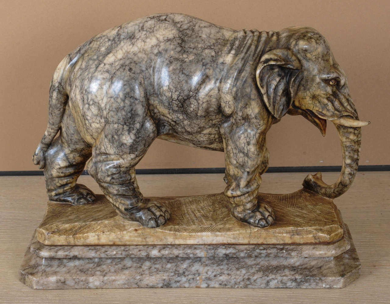 A grey/white coloured marble elephant.
One tusk partly broken.
signed as N.Forrini