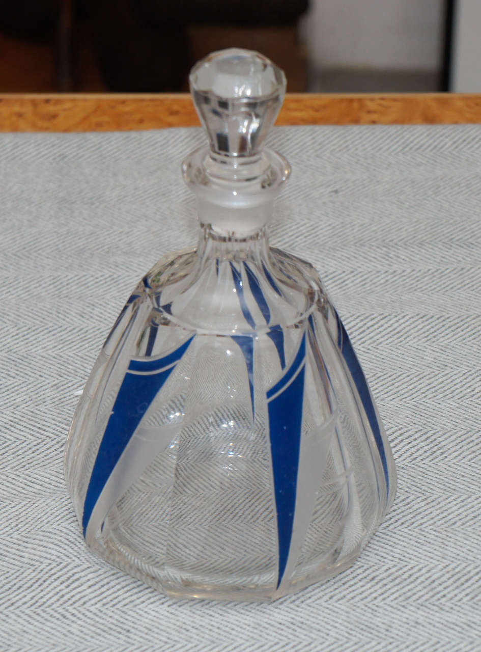 Blue and clear glass French Art Deco perfume bottle. Cobalt blue and clear
glass decoration on body of bottle.  Cut glass stopper