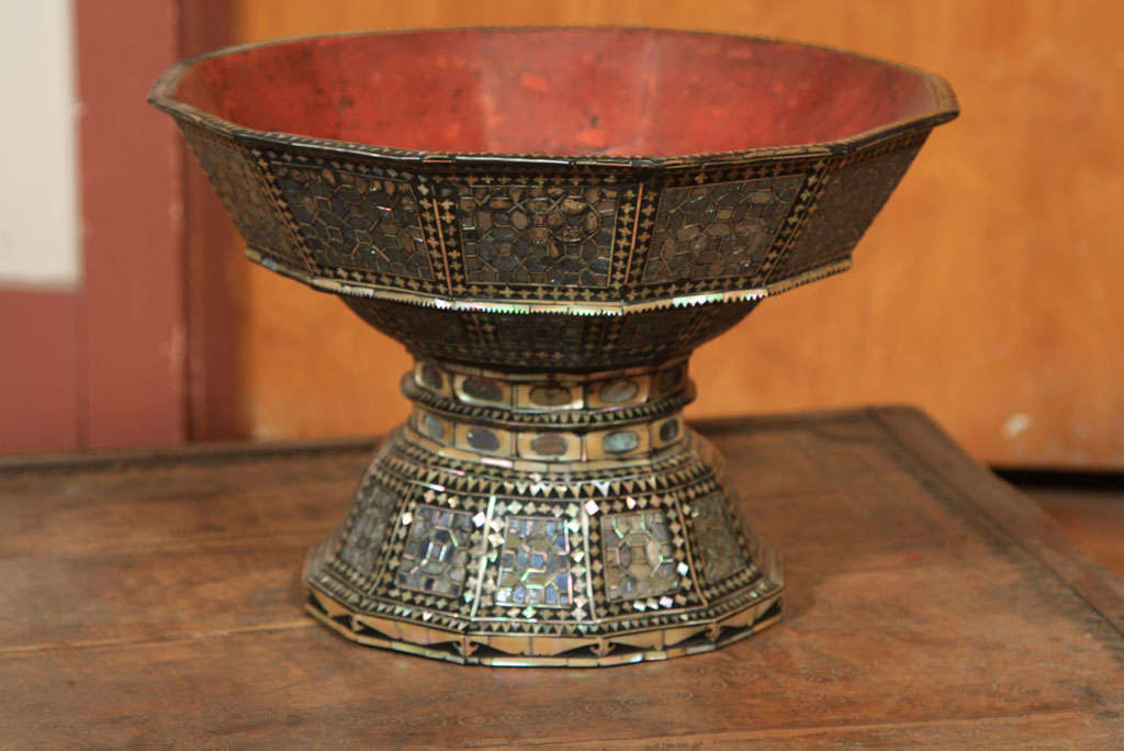 OFFERING BOWL MADE IN TWO PARTS OF LACQUER AND MOTHER-OF-PEARL. THE PEARL SHELL PROTRUDES FROM THE SURFACE IN PLACES. A MIXTURE OF NATURAL LACQUER AND PLASTER IS USED TO BUILD THE SURFACE PAINSTAKINGLY STEP BY STEP UNTIL IT IS EVEN. IN THE CASE OF