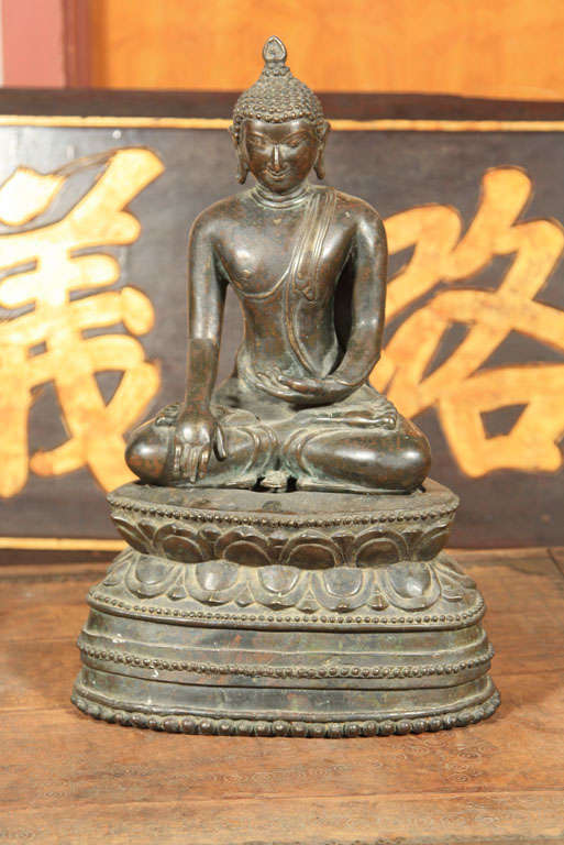 Bronze buddha in style of 10th Century pagan style. Cast in two pieces. Used for hanging on wall of temple.. Made of Bronze