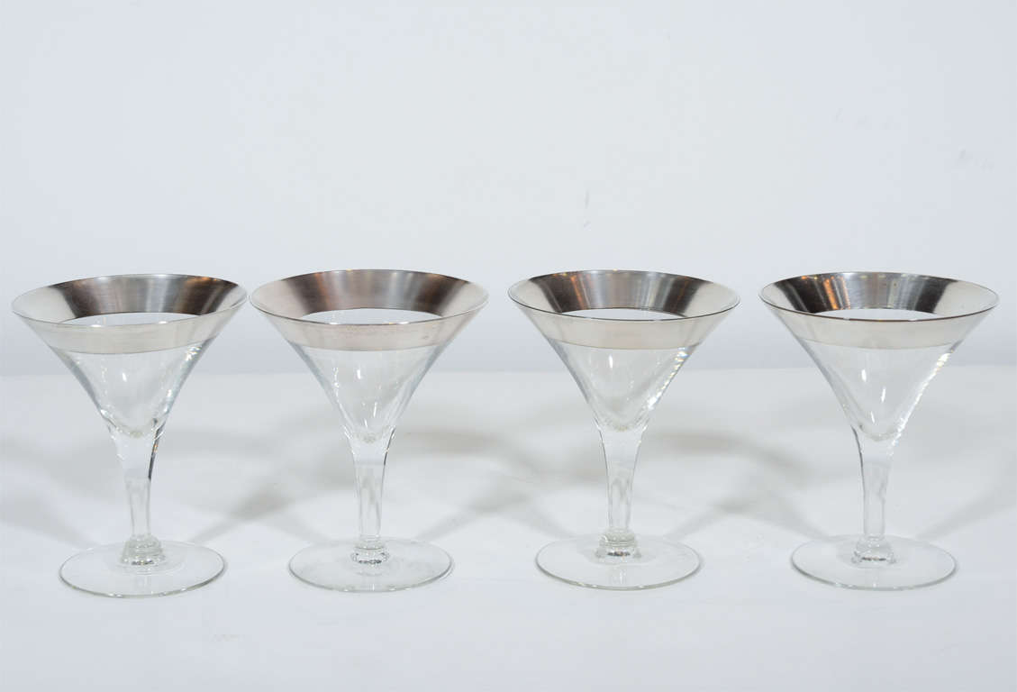 Elegant set of eight 1940s Hollywood martini glasses with sterling silver banding. Each glass features a seamless curved stem.