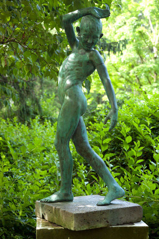 An exceptional bronze figure of a youth, in a fluid pose, the face with jubilant expression and downward gaze, with one arm upswept and the other down, with one leg crossed in front of the other, suggesting movement.