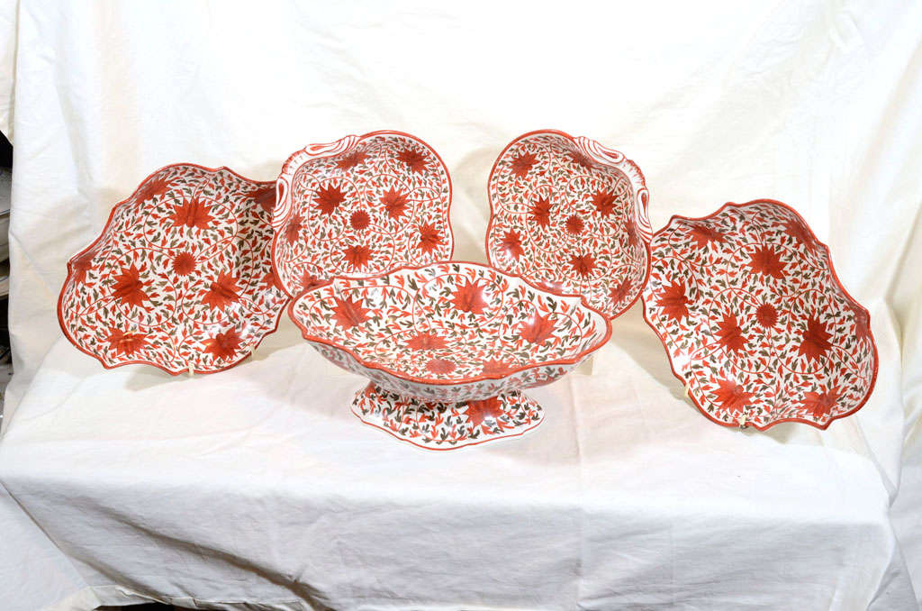 A group of Creamware dishes with overall decoration of chrysanthemums and swirling leaves made by Baddely 1784-1806.
The group consists of a pair of oval dishes, a pair of shell shaped dishes, and a compote (five pieces).
The underside of some