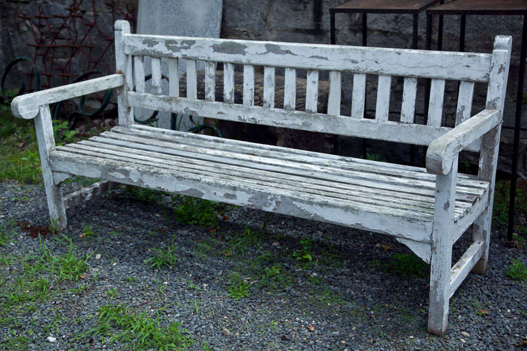 We love this teak bench for its chippy white painted surface over silvered teakwood and its clean, uncomplicated lines.  Very sturdy, it has had one seat slat replaced, but we don't care and likely can make it undetectable with a little white paint.