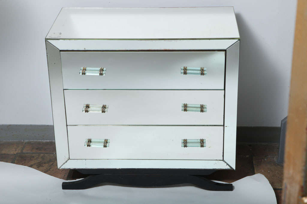 A wonderful pair of vintage Maison Jansen French mirrored three-drawer commodes with original glass handles on a splayed wood legs.