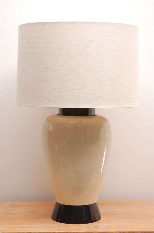 Handsome large glazed earthenware lamp on ebonized wood mount, designed by William Haines for the Deutsch estate in Los Angeles.

The lamp has been rewired and the custom linen shade is new.  Originally purchased from the Deutsch estate sale at