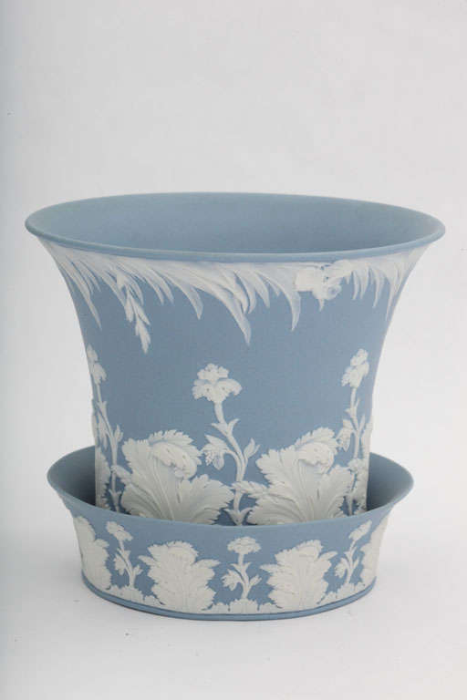 A fine Wedgwood blue and white jasper flower pot and underplate decorated with flowers and leaves,impressed upper case mark